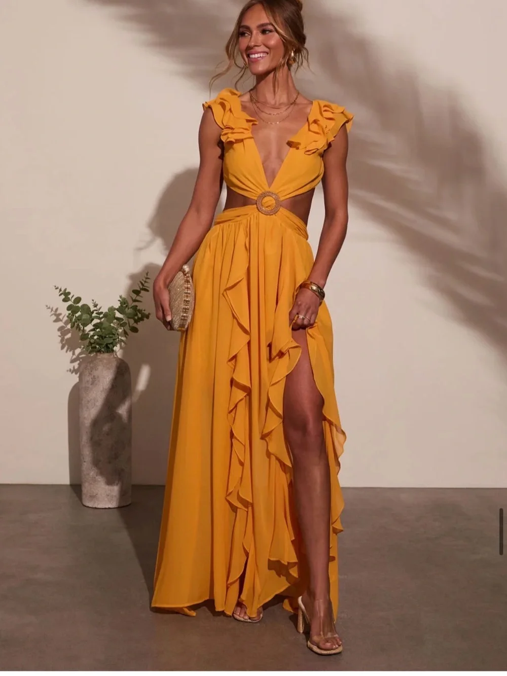 Sleeveless Ruffle Cutout Maxi Dress in Mustard “Carlita Ruffle Cutout
Maxi Dress - Picture 1 of 7